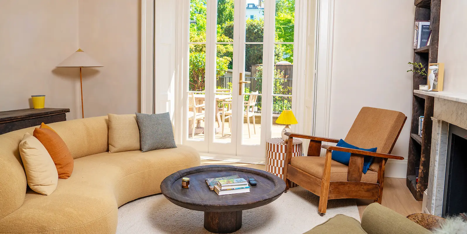 Victorian house renovation in Notting Hill with garden access, fireplace, and modern furnishings.