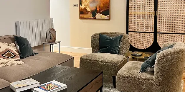 Basement conversion in London featuring modern living room with bespoke furnishings.