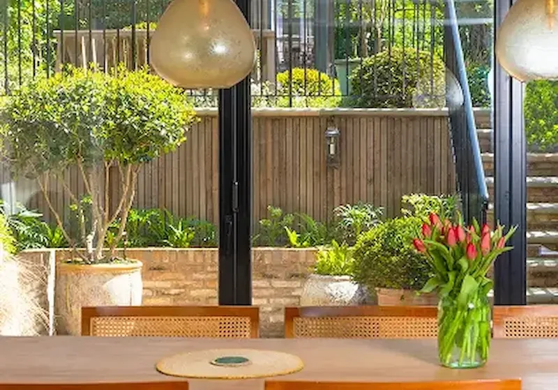 Builders in Chelsea designing and constructing a bespoke modern kitchen with island and cabinetry.