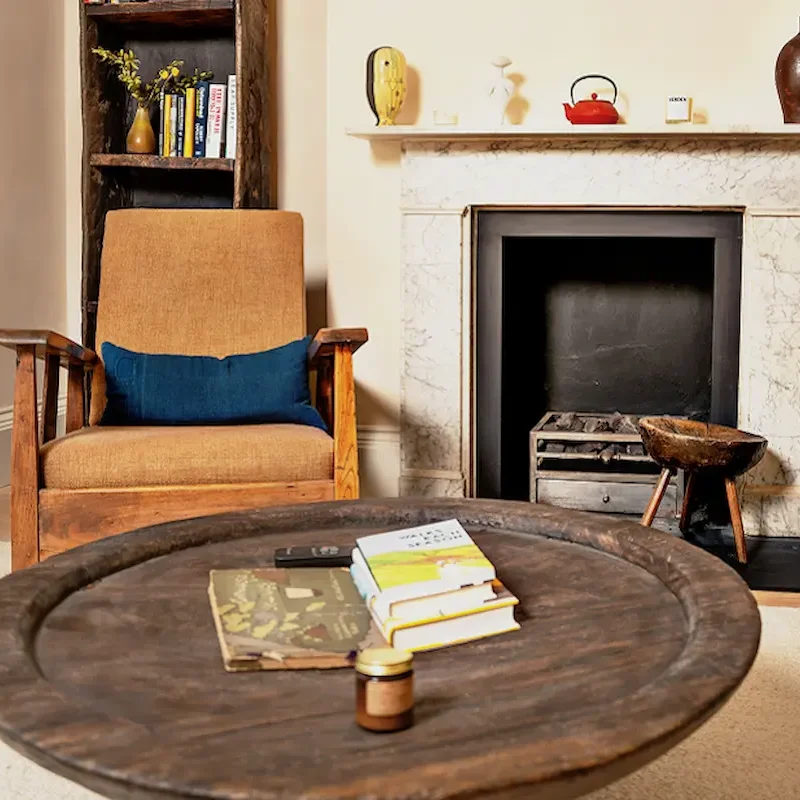 Elegant fireplace renovation with wooden accents by builders in Notting Hill