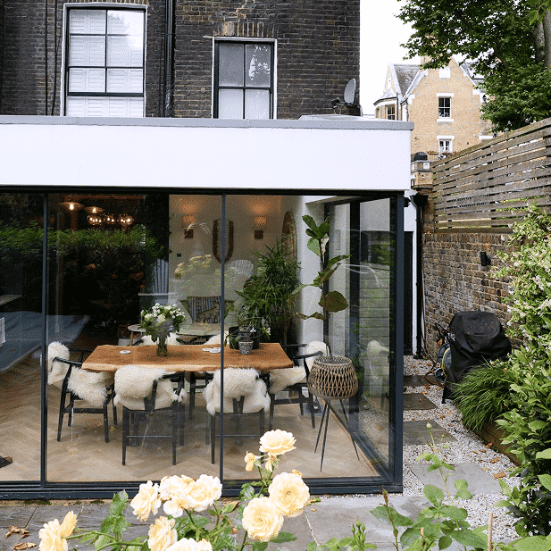 Renovated Notting Hill home with glazed rear living space opening onto the garden.