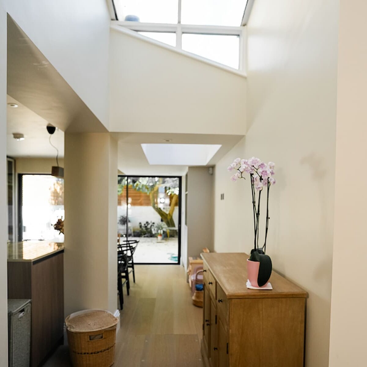 House extensions London with bright hallway and skylight design.