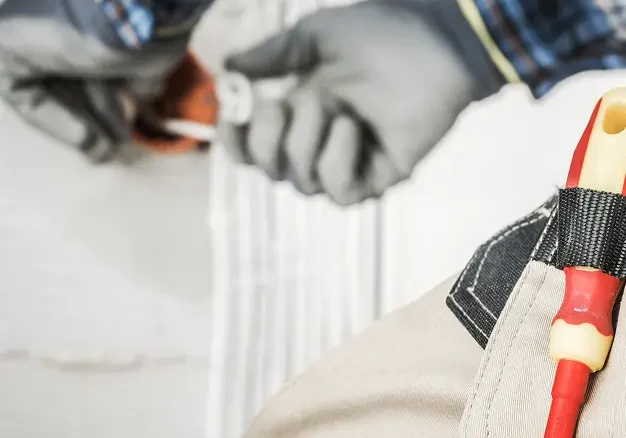 Property maintenance London with ladder, tools, and renovation equipment in residential interior.