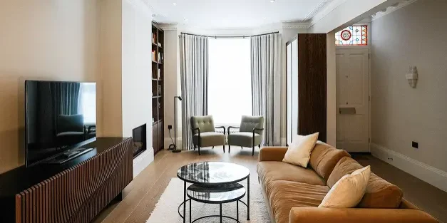 Modern living room refurbishment in London with bespoke cabinetry and luxury finishes.